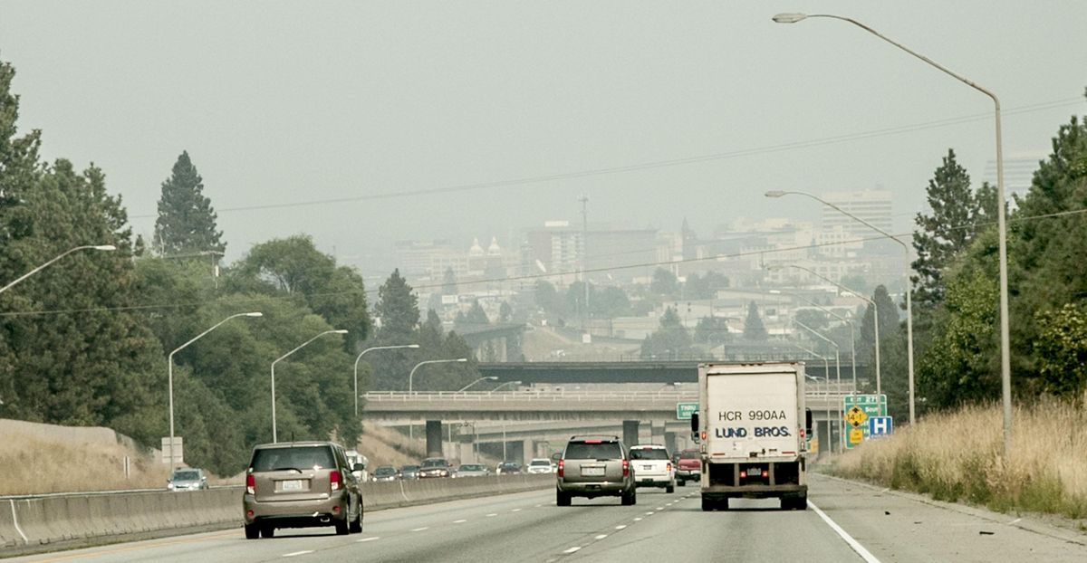 Motorists drive into the smoke toward Spokane from Interstate 90 East on Friday, Sept. 8, 2017. (Kathy Plonka / The Spokesman-Review)