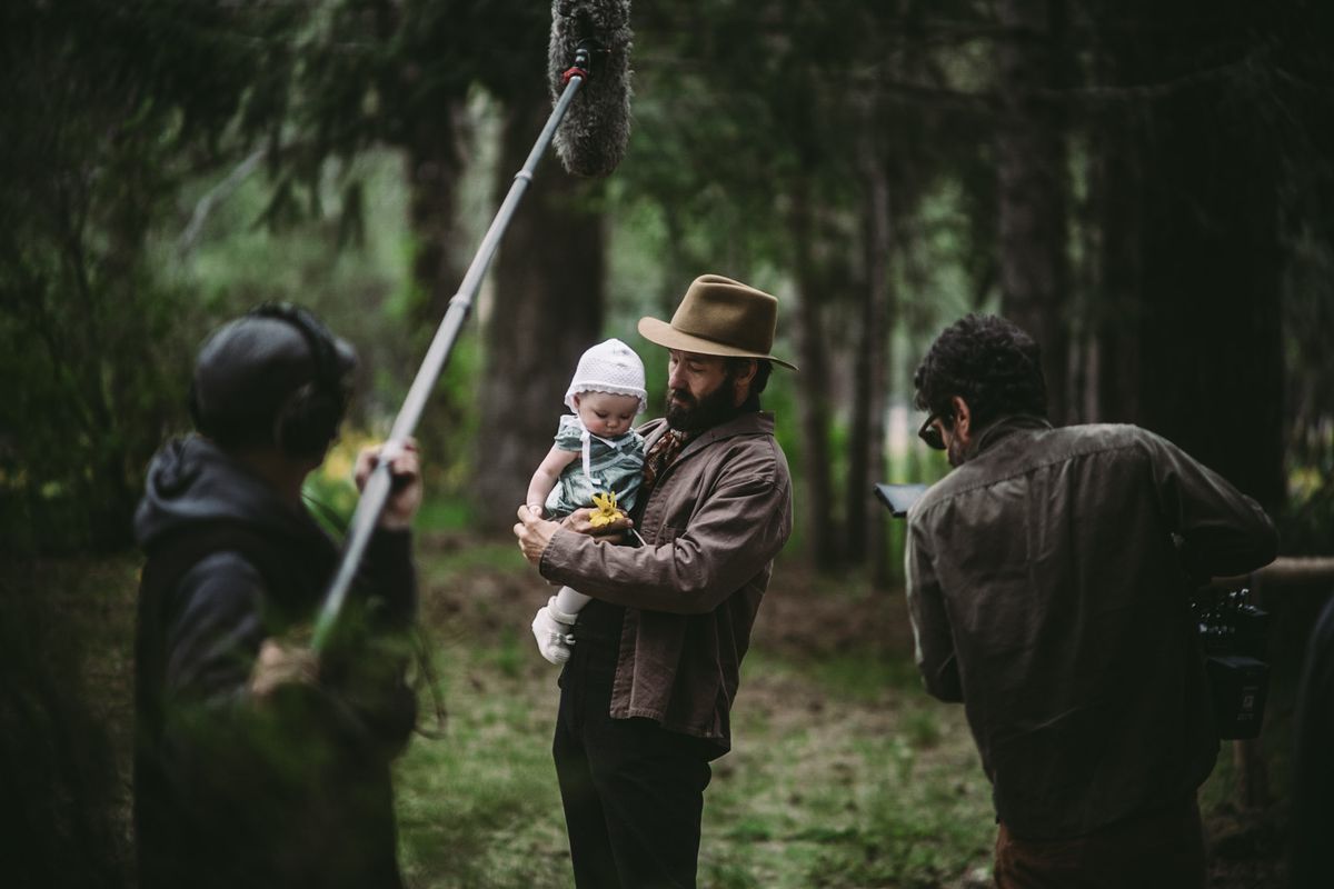 Joel Edgerton holds his on-screen daughter as cinematographer Adolpho Veloso gets the shot.  (Courtesy of Daniel Schaefer)