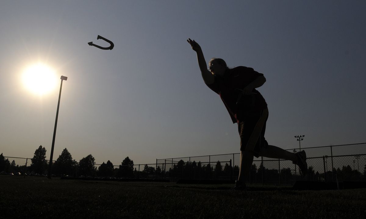 Spokane Horseshoe Pitching Association member Kaiti Reeves works on her tossing technique at Franklin Park on July 22.chris@spokesman.com (Christopher Anderson / The Spokesman-Review)