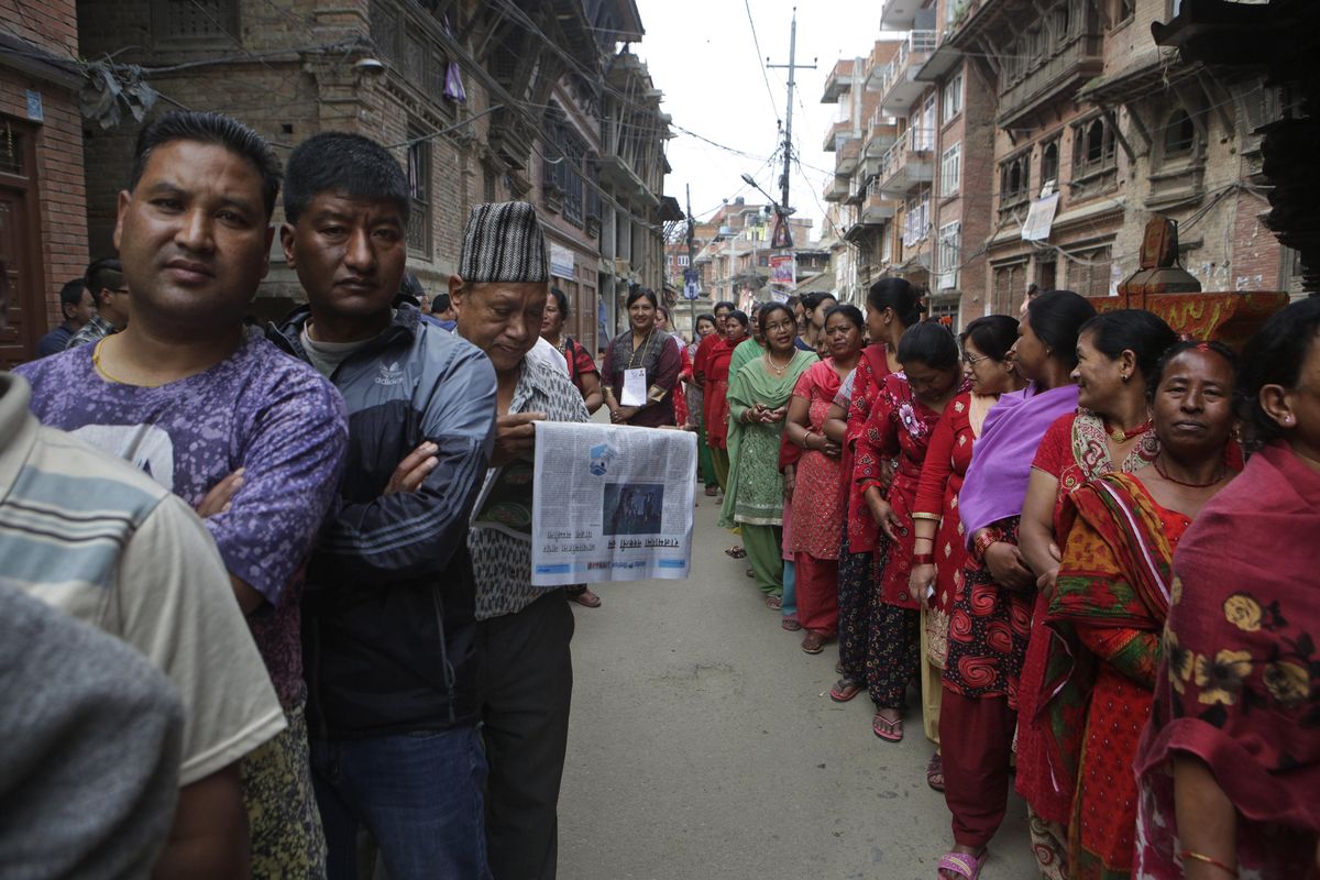 Nepalese stand in a queue to cast their votes at a polling station during the local election in Bhaktapur, Nepal, Sunday, May 14, 2017. Nepalese lined up to vote Sunday for representatives in municipality and village council positions held in the Himalayan nation for the first time in two decades. (Niranjan Shrestha / Associated Press)