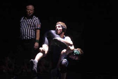 
Central Valley's Tanner Teeples picks up East Valley's Shelby Lawson during Teeples' 12-11 victory at 103 pounds. 
 (Jed Conklin / The Spokesman-Review)
