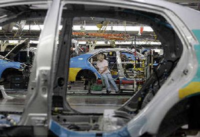 
Toyota cars move along an assembly line at the Toyota plant in Georgetown, Ky..  
 (Associated Press / The Spokesman-Review)