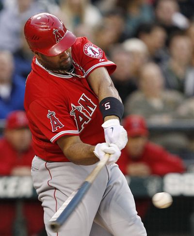 Angels' Albert Pujols had three hits, including a homer, against the M’s. (Associated Press)