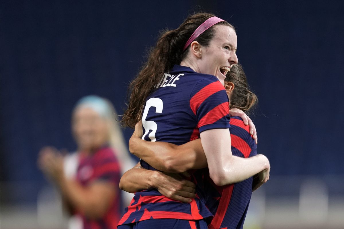 United States’ Rose Lavelle, left, celebrates after scoring a goal during a women’s soccer game against New Zealand at the 2020 Summer Olympics on Saturday in Saitama, Japan.  (Associated Press)