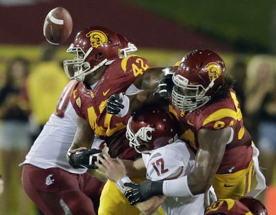 USC defensive end Leonard Williams, right, might be the nation’s best player in the trenches. The junior has six sacks this season. (Associated Press)