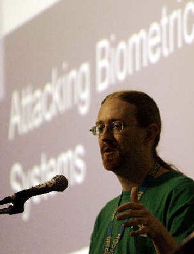 
A security analyst who goes by the name Zamboni speaks about attacking Biometric Systems at the Defcon Convention. 
 (Associated Press / The Spokesman-Review)