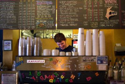 
David Fairbairn makes a drink during the morning hours at the Rocket Bakery in Millwood recently.
 (Liz Kishimoto photos/ / The Spokesman-Review)