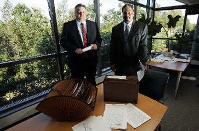 
Kevin Ludden, left, and Michael E. Wade pose at their Freddie Mac office in Mclean, Va. 
 (Associated Press / The Spokesman-Review)
