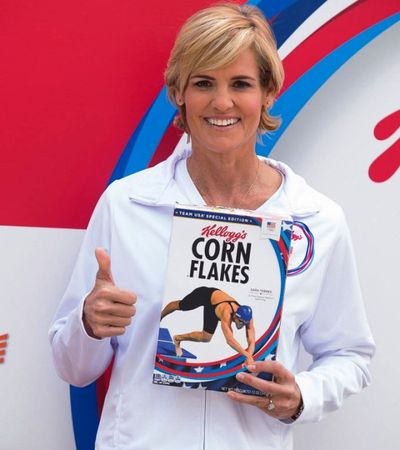 Dara Torres, five-time U.S. Olympian and captain of Team Kellogg’s®, poses with her own Corn Flakes® box as she helps introduce the team before the start of the Rio 2016 Olympic Games. (Charles Sykes/AP Images for Kellogg's) 