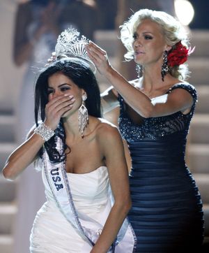 Miss Michigan Rima Fakih, left, reacts as she is crowned Miss USA 2010 by Kristen Dalton, Miss USA 2009, Sunday, May 16, 2010 in Las Vegas. (Isaac Brekken / Fr159466 Ap)