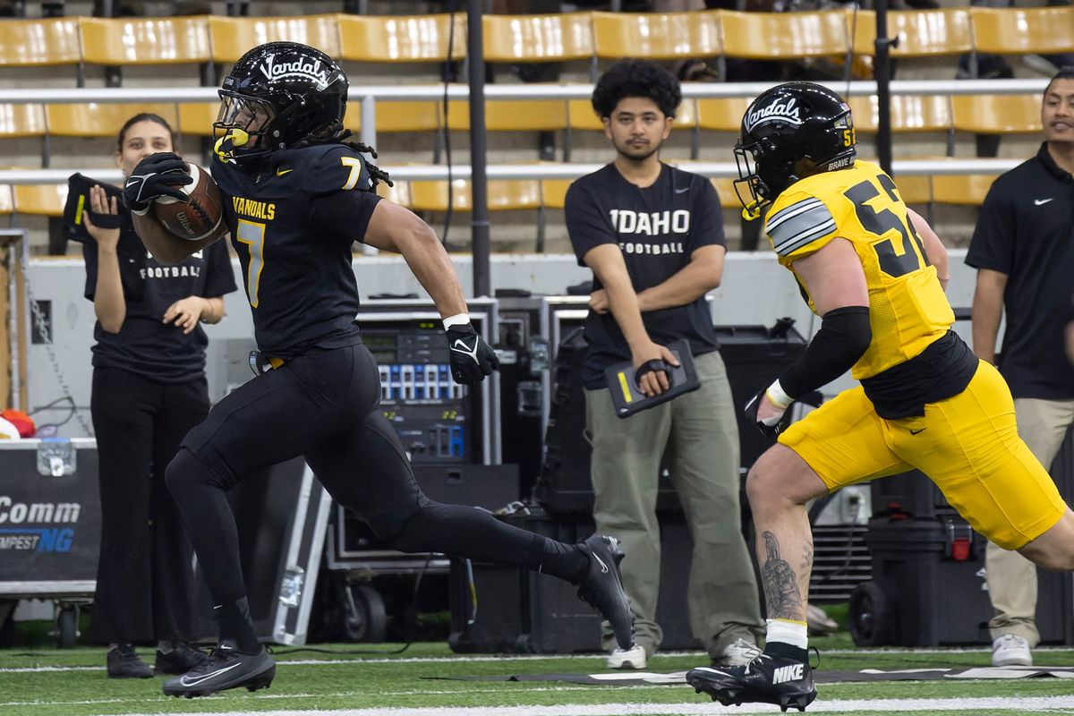 Idaho running back Damonte Bias breaks away from linebacker Jack Giannini during the team’s spring game on Friday at the Kibbie Dome in Moscow, Idaho.  (Geoff Crimmins/For The Spokesman-Review)