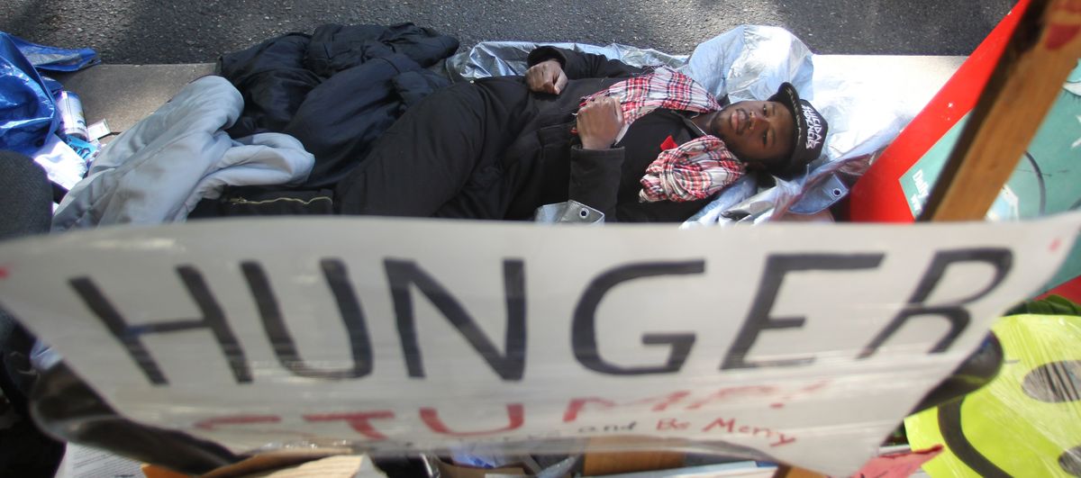 Cameron Whitten, lies on the ground during his hunger strike outside Portland City Hall last week. Whitten, an Occupy Portland activist who finished 5th of 23 candidates in last month