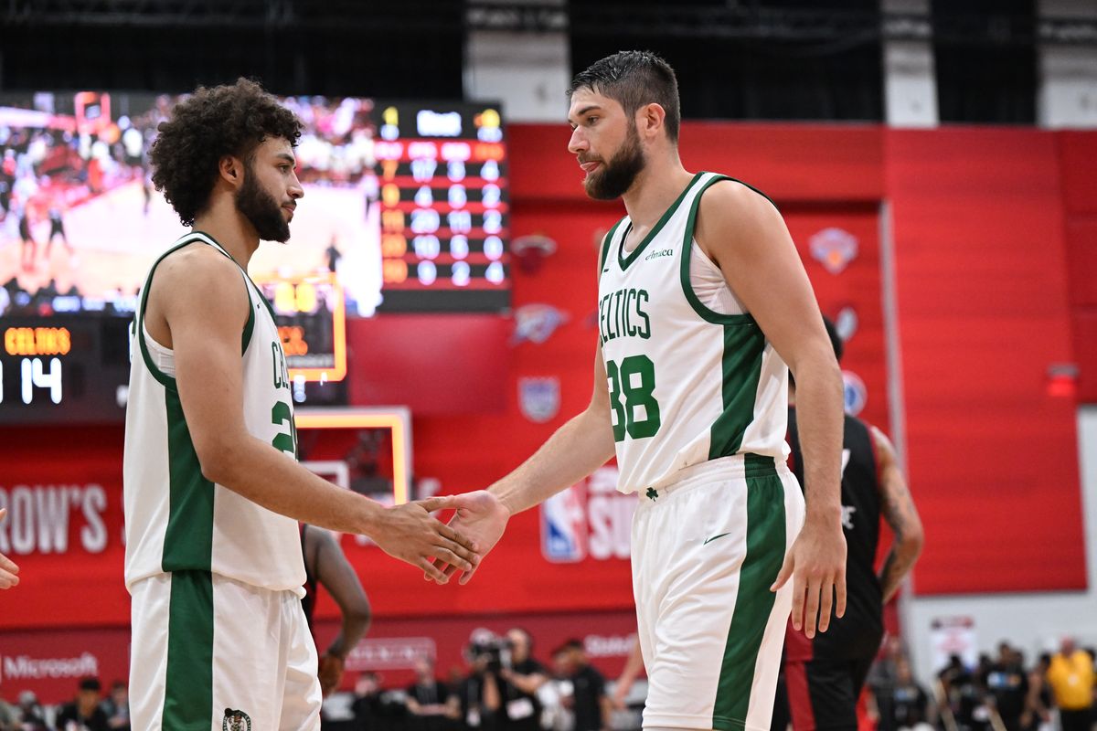 Boston forward Anton Watson (28) high-fives fellow Zag Killian Tillie after they fell to the Miami Heat during an NBA Summer League matchup on Saturday,Jul. 13, 2024, at Cox Pavilion in Las Vegas, Nev.  (Tyler Tjomsland/The Spokesman-Review)