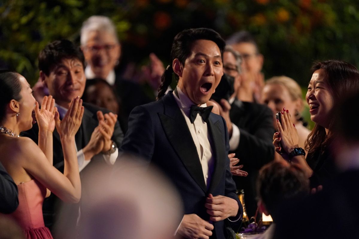 Lee Jung-Jae reacts in the audience as he is announced the winner for the award for outstanding performance by a male actor in a drama series for “Squid Game” at the 28th annual Screen Actors Guild Awards at the Barker Hangar on Sunday, Feb. 27, 2022, in Santa Monica, Calif. (Chris Pizzello)