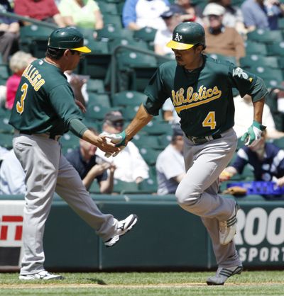 Oakland outfielder Coco Crisp tours the bases after he hit a solo home run to lead off the game. (Associated Press)