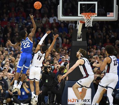 Kentucky’s Carson Wallace (22) puts up a shot against Gonzaga’s Nolan Hickman at the Spokane Arena on Sunday.  (Jesse Tinsley/The Spokesman-Review)