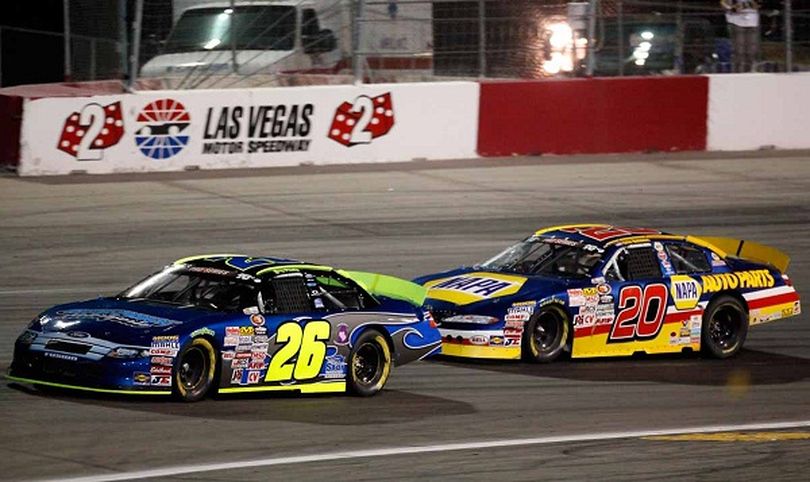 Eric Holmes (20) pursues Greg Pursley (26) early at Las Vegas. (Photo Credit: Jeff Bottari/Getty Images for NASCAR)