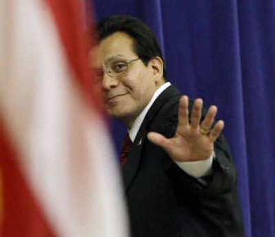 
Alberto Gonzales walks offstage after his farewell ceremony on his last day of work as attorney general Friday in the Great Hall at the Justice Department in Washington. Associated Press
 (Associated Press / The Spokesman-Review)