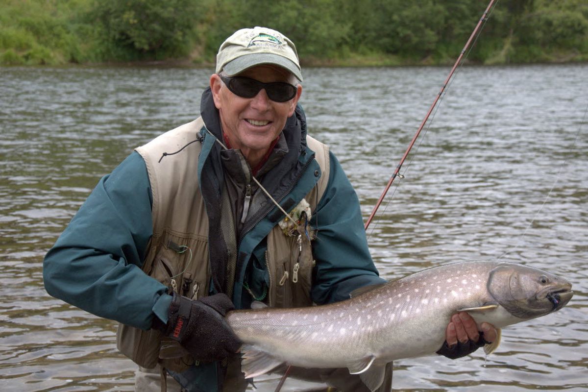 Don Childress of Sandpoint prepares to release a Siberian white-spotted char while fly fishing in the Kamchatka region of Russia. (Courtesy)