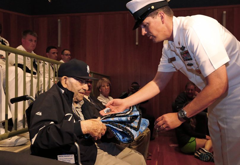Quilts of Honor presented Yogi Berra with a quilt and a medal during D-Day presentation at Yogi Berra Museum. (Associated Press)