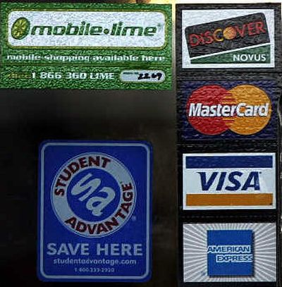 
A MobileLime's sign is seen on the entrance of Angora Cafe in Boston. MobileLime provides a new service designed to let you leave your wallet at home or at least some of the cards in it and instead use your cell phone to buy things.
 (Associated Press / The Spokesman-Review)