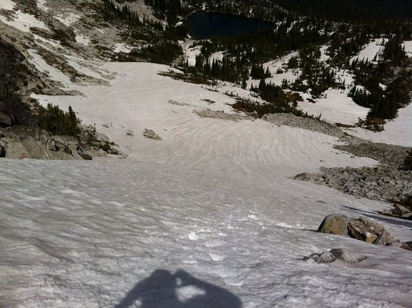 Seeing the late opportunity to make some turns on the snow fields above Beehive Lakes, skier Mike Brede trekked in on July 7, 2013, and found enough snow to make a run of 975 vertical feet from twin Peaks down to the upper Beehive Lake.  (Mike Brede)
