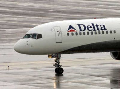 
A Delta plane is seen on the ground at Phoenix Sky Harbor International Airport in January. Delta Air Lines Inc., the nation's third-largest carrier, reported Tuesday a wider profit in the third quarter on higher sales and fuel hedging. Associated Press
 (File Associated Press / The Spokesman-Review)