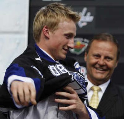 
First overall draft pick Steven Stamkos puts on his jersey from the Tampa Bay Lightning. Associated Press
 (Associated Press / The Spokesman-Review)