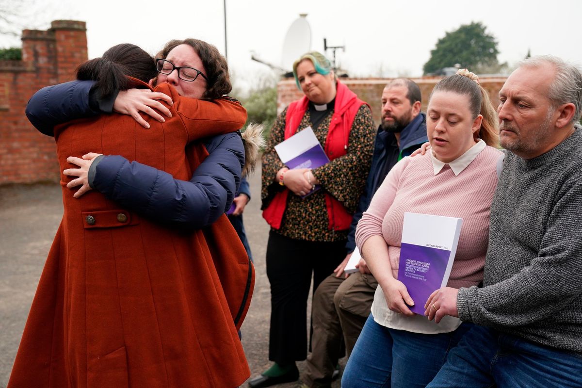 Rhiannon Davies, left, embraces Kayleigh Griffiths, following the release of the final report by Donna Ockenden, chair of the Independent Review into Maternity Services at the Shrewsbury and Telford Hospital NHS Trust, at The Mercure Shrewsbury Albrighton Hotel, Shropshire, England, Wednesday, March 30, 2022. A review into a scandal-hit British hospital group said Wednesday that persistent failures in maternity care contributed to the avoidable deaths of more than 200 babies over two decades. The review began in 2018 after two families that had lost their babies in the care of Shrewsbury and Telford NHS Trust in western England campaigned for an inquiry.  (Jacob King)