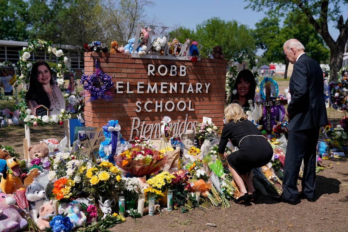President Joe Biden and first lady Jill Biden visit Robb Elementary School to pay their respects to the victims of the mass shooting, Sunday, May 29, 2022, in Uvalde, Texas.  (Evan Vucci)