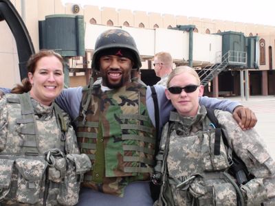 Seahawks defensive back Josh Wilson poses with a pilot, left, and gunner of a Blackhawk helicopter.  (Associated Press / The Spokesman-Review)