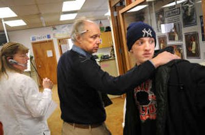 
Principal Cleve Penberthy tries to convince Nathan Long, 17, to come to class Thursday morning as the school session begins at Contract-Based Education.
 (The Spokesman-Review)