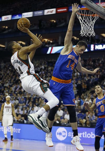 Bucks’ Giannis Antetokounmpo shoots for two of his 16 points as Milwaukee handed the Knicks their 16th consecutive loss. (Associated Press)