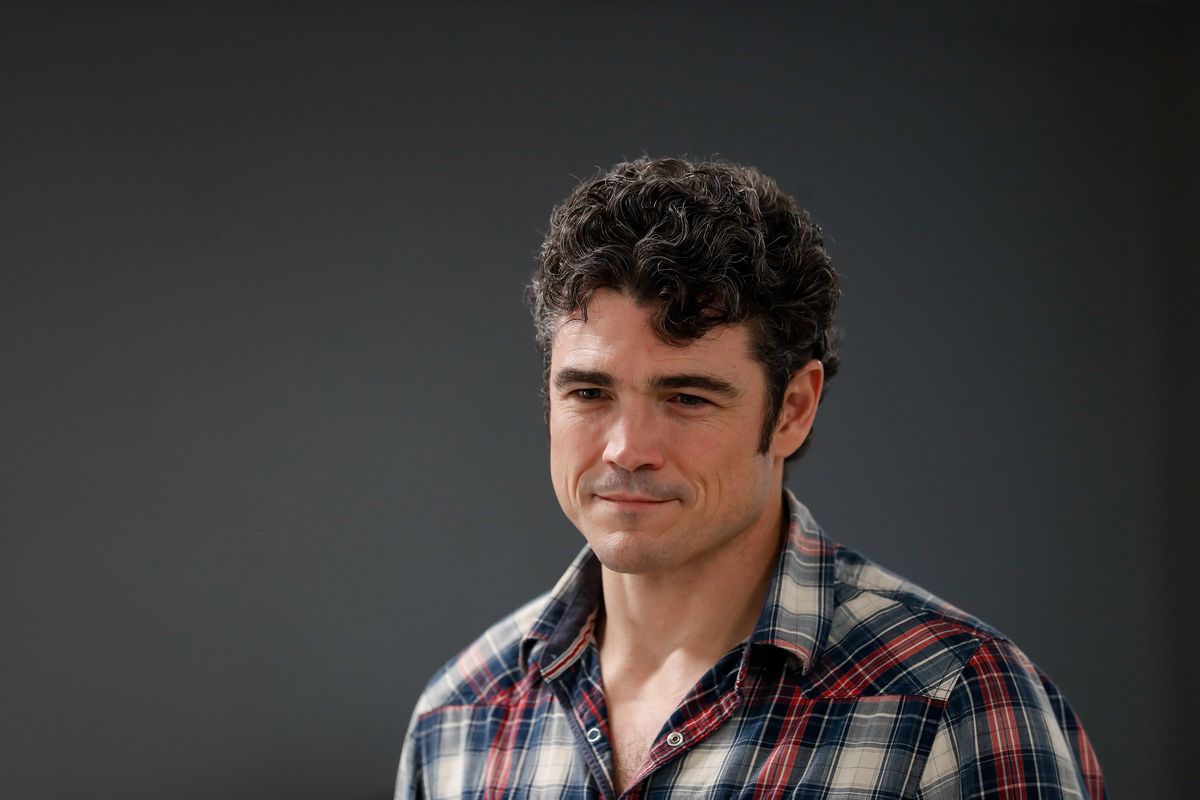 Joe Kent chats with early arrivers to his town hall event on March 22, 2022 in Longview, Washington.  (Jennifer Buchanan/The Seattle Times/TNS)