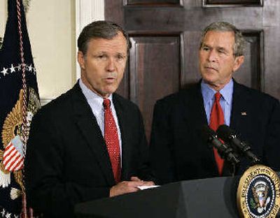 
Rep. Christopher Cox, R-Calif., thanks President Bush for naming him to succeed William Donaldson as chairman of the Securities and Exchange Commission, at the White House in Washington, on June 2. 
 (Associated Press / The Spokesman-Review)