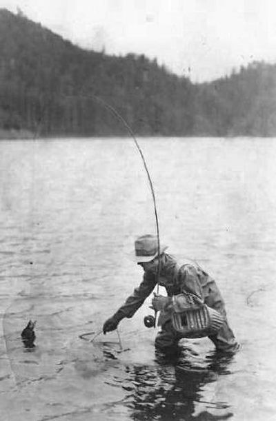 
J.W. Bayley lands a trout circa 1935 from Bayley Lake east of Chewelah. Bayley's family lived at the lake, where he raised deer and trout for sale. It's a fly-fishing-only lake on the Little Pend Oreille National Wildlife Refuge. 
 (Photo courtesy of Maxine Bayley Matney / The Spokesman-Review)