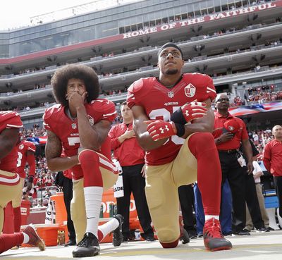 FILE - In this Oct. 2, 2016 file photo, San Francisco quarterback Colin Kaepernick, left, and safety Eric Reid kneel during the national anthem before an NFL football game against the Dallas Cowboys in Santa Clara, Calif. Reid, currently a free agent, said he doesn’t plan to kneel during the national anthem during the 2018 season. (Marcio Jose Sanchez / Associated Press)