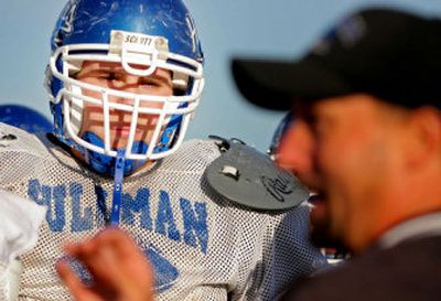 
Pullman's Jeff Jones listens to coach Bob Wollan address the team. 
 (Christopher Onstott/ / The Spokesman-Review)