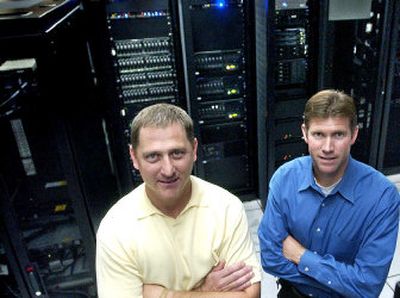 
IT-Lifeline's vice president for client services Ben Cozza and president and CEO Steve Tabacek pose in the company's Liberty Lake data center. 
 (Joe Barrentine / The Spokesman-Review)