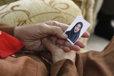 Akiko Saberi, the mother of imprisoned Iranian-American journalist Roxana Saberi, holds a photo of her daughter while in Tehran, Iran, on Saturday.  (Associated Press / The Spokesman-Review)