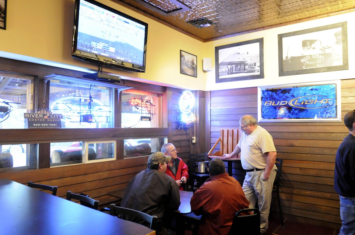 Patrons sit inside the newly remodeled Spangle Saloon. (Jesse Tinsley / The Spokesman-Review)