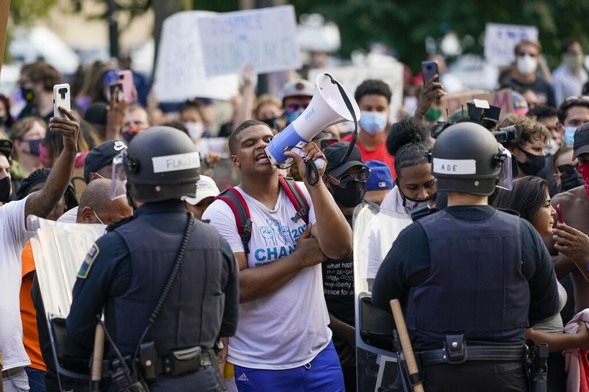 Protesters chant Monday outside the Kenosha (Wisc.) County courthouse after the police shooting of a Black man in the area turned it into the nation’s latest flashpoint in a summer of racial unrest.  (Morry Gash)