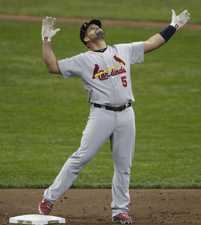 Albert Pujols drove in five runs for the Cardinals in a 12-3 rout of the Brewers. (Associated Press)