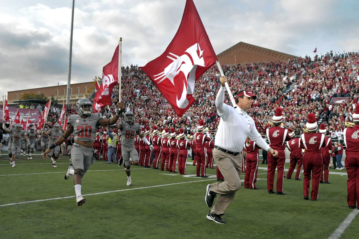 WSU Head Coach Paul Wulff leads his flag carrying players into Martin Stadium in Pullman for their game against Stanford, Oct. 15, 2011. (Christopher Anderson / Spokesman-Review)