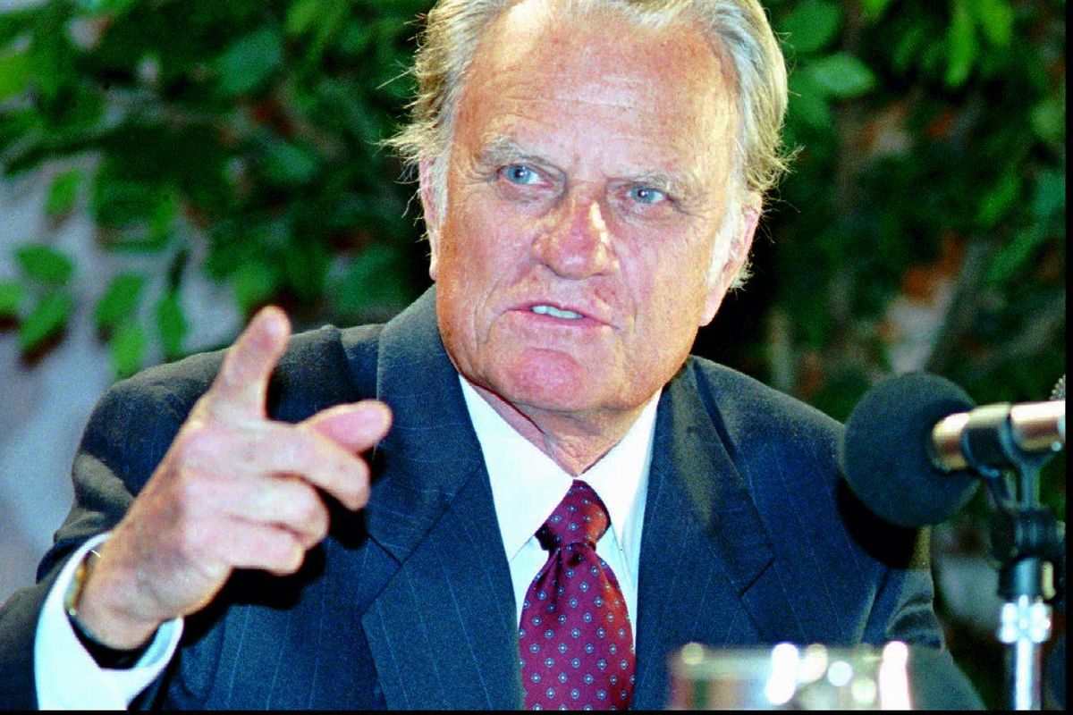FILE – U.S. evangelist Billy Graham speaks at a press conference in Hong Kong on Feb. 3, 1994. Graham said he was carrying a message from North Korean leader Kim Il Sung to U.S. President Bill Clinton. Graham, who declined to disclose the contents of the message, arrived in Hong Kong  from North Korea where he met Kim. (BOWLES CHAN / Associated Press)