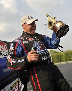 Robert Hight celebrates his NHRA Full Throttle Drag Racing Series Funny Car victory at zMAX Dragway in Concord, NC. (Photo courtesy of NHRA)