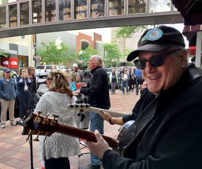 Peter Rivera, center, and Doug Clark perform on Main Avenue during Street Music Week, June 16, 2016, in downtown Spokane, Wash. (SR file photo)