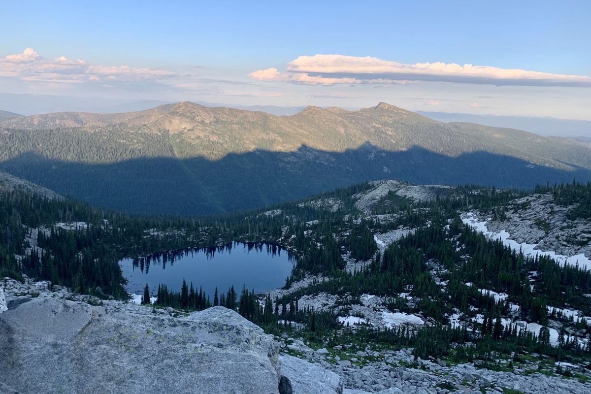 Above Beehive Lake, the peaks of the Seven Sisters cast their shadow.  (Ammi Midstokke/courtesy)