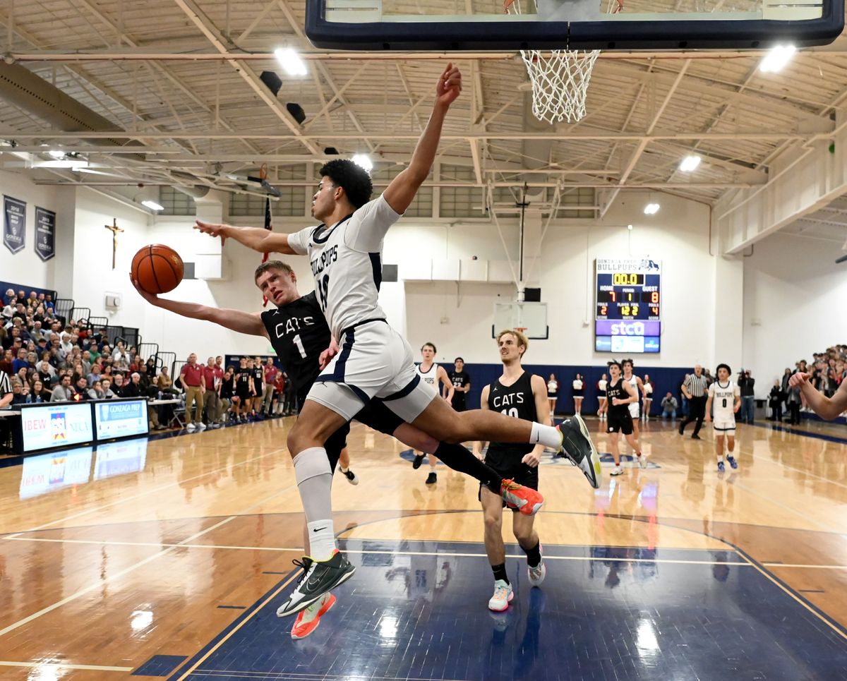 Gonzaga Prep guard Jamil Miller (10) stops a shot by Mt. Spokane guard Lucas Dickau (1) during a GSL high school basketball game, Friday, Jan. 13, 2023, at Gonzaga Prep.  (Colin Mulvany/The Spokesman-Review)