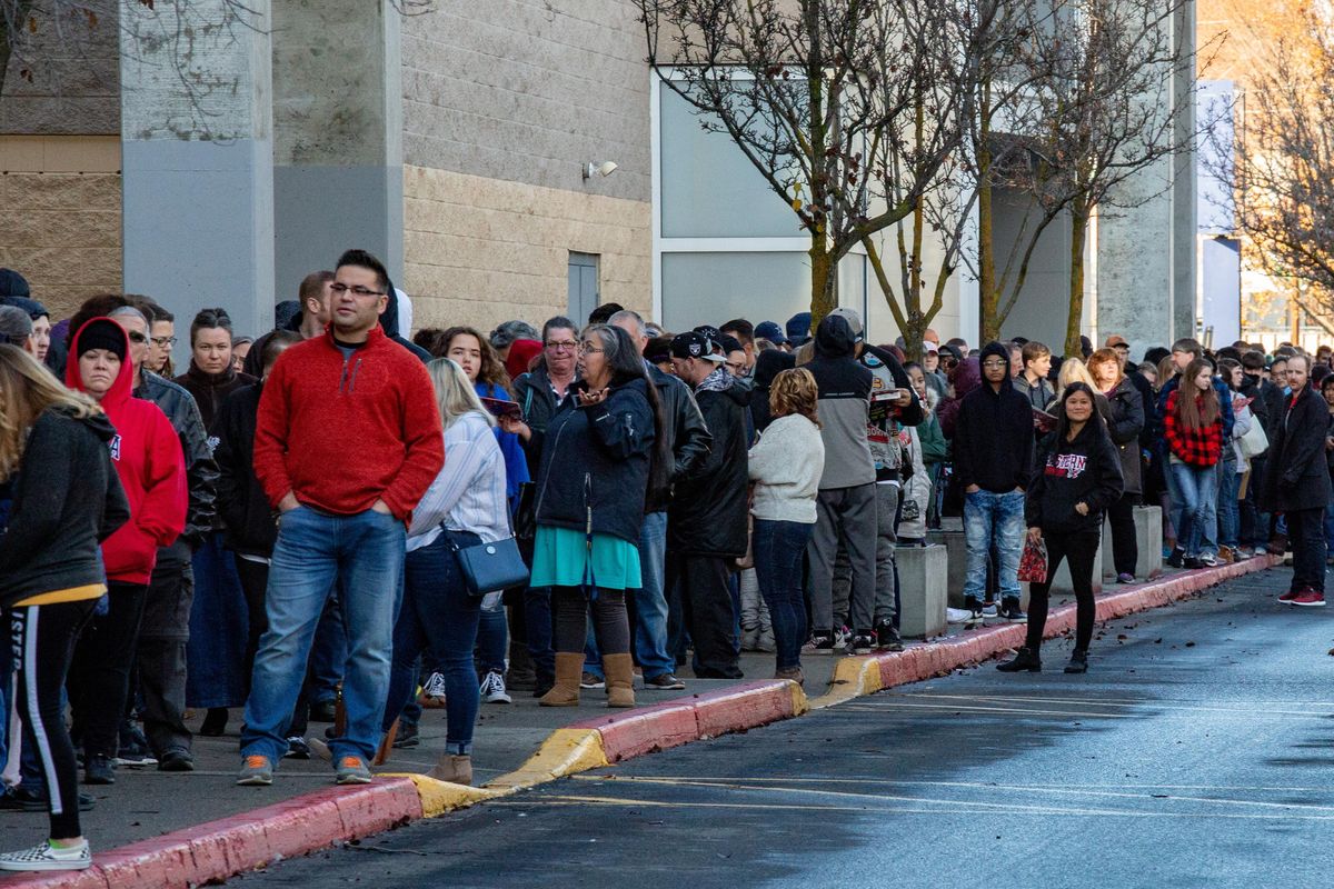 Customers wait in line for JC Penney’s Black Friday sale at NorthTown Mall in Spokane on Thursday, Nov. 22, 2018. Doors opened at 2 p.m. for shoppers to get their hands on deals, many before they’d even had their Thanksgiving meals. (Libby Kamrowski / The Spokesman-Review)